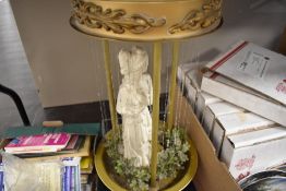 A water lamp having classically styled figure to centre.