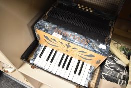 A cased Steldeni piano accordion, blue marbled decoration