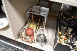 A mid century set of croquet hoops and balls.