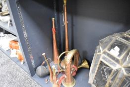 Two copper and brass hunting horns (un-named) two larger examples, a vintage brass car horn and J.