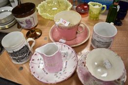 A selection of Victorian souvenir mugs and a jug of Blackpool and Bradford interest, also included