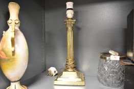 A brass Corinthian column table lamp, of traditional form with reeded column and stepped square