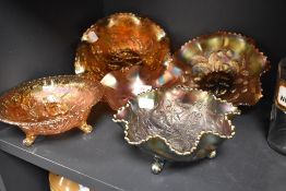 A group of five carnival glass dishes, to include Northwood 'wishbone', ruffled in iridescent