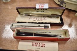 A group of three silver, white and yellow metal propelling pencils and a Swan 'self-filler' Mabie