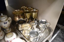 A collection of flatware including goblets,tray, tankards and more.