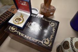 An early 20th century transfer-decorated mahogany work box, plush-lined, together with a