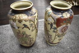 A pair of large reproduction 'Satsuma' pottery vases of elongated ovoid form, decorated with
