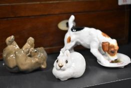 A collection of figure studies including Royal Doulton Jack Russel eating from plate, USSR Rabbit