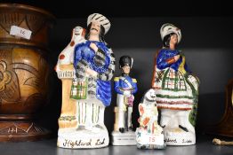 A group of three Staffordshire pottery style figures and one Chinese figure