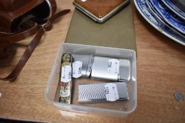 A selection of mid century Ronson lighters, a cigarette case and similar.