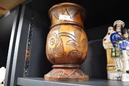 A 20th century treen vase, with incised stylised foliate decoration