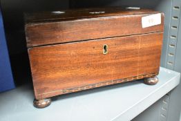 A 19th century mahogany twin compartment tea caddy, of plain rectangular form, the base with