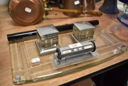 A 1930's design glass and chrome desk stand (AF) together with a rolling desk calendar and