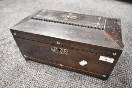 A late Victorian Mother-of-pearl inlaid rosewood tea caddy, of sarcophagus form with ring handles to