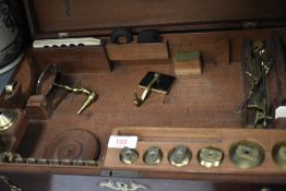A 19th century mahogany cased brass travelling compound monocular microscope, the interior with