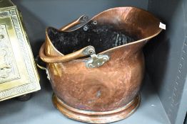 A late 19th/early 20th century copper coal helmet, of good colour. Used with denting throughout.