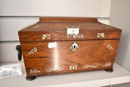 A Victorian Mother-of-Pearl inlaid rosewood sarcophagus form tea caddy, with turned ring handles