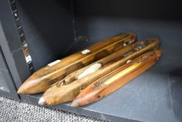 A group of three vintage loom shuttles
