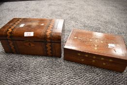 A 19th century walnut box, of domed rectangular form, decorated with bands of geometric inlay.