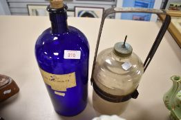 A large antique Bristol blue glass partially ribbed poison bottle labelled for Boots 'Liq