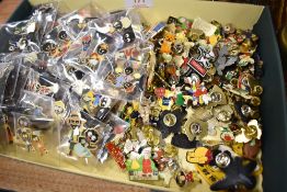 A large collection of Robertson's Jam badges, and others