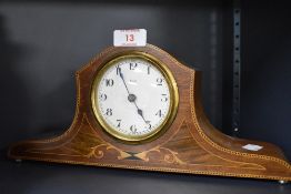 An Edwardian inlaid-mahogany mantel clock, the dial with Arabic hours marked '8 Day' 'Made in