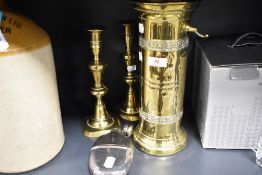 An early 20th century cylindrical brass companion stand, a pair of brass candlesticks and silver