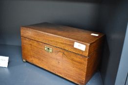 A late Victorian Rosewood tea caddy, of plain hinged rectangular form, with two internal