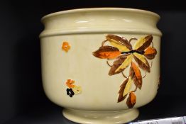 A 1930's Myott, Son & Co jardinaire, moulded and hand-painted in earthy tones with foliage