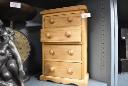 A small modern pine chest of four drawers
