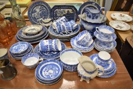 A selection of mixed blue and white china, Willow pattern and floral designs