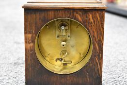 An early 20th century oak mantel clock, with Arabic hours to dial, the brass movement marked '