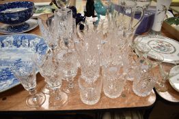 A part suite of cut-crystal glasswares, unmarked but in the Waterford Lismore style