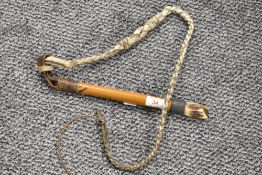 A 20th century bamboo, plaited leather, carved antler and wire-bound bull whip with whistle to