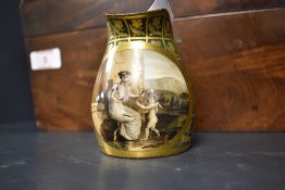 A small porcelain beaker being hand decorated with scene of a cherub signed A Dagoty Paris (handle