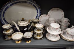 A part Royal Osborne foliate pattern teaset, a continental black and gilt coffee set and an oval