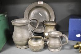 A small selection of pewter wares, plate, tankards
