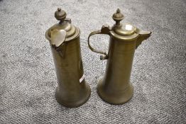 A pair of continental pewter (possibly colonial) flagons or jugs, of spreading cylindrical form with