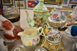 A Clarice cliff jug in the Crocus design, a large flamboyant Capodimonte tea pot and a similar