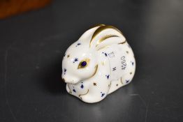 A Royal Crown Derby 'baby rabbit' paperweight, with silver coloured stopper to base