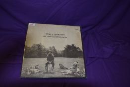 A VG copy of All Things Must Pass - box a little on the tatty side - no poster