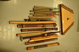 A selection of musical instruments, including tin whistles and zither cymbala