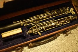 A traditional oboe, unnamed, in hard leather case