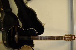 A Westcoast solid Slim Electro Nylon Guitar In Black, looks similar to the Yamaha AEX 500 which is