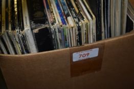 A box of albums and seven inch singles - random selection
