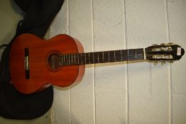 A Kasuga G-100L classical concert guitar