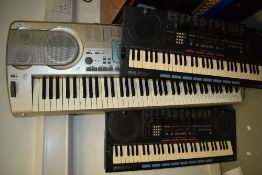 Two Yamaha PSS-790 keyboards and a Casio Keyboard, with one travel bags