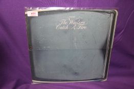 A first press of the Wailers ' Catch a Fire ' in the extremely rare Zippo ' flip top ' sleeve -