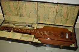 A vintage lap steel guitar , Art Deco design, in custom made box, with accesories