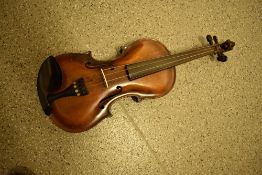 A traditional violin/fiddle having two piece 14' back, stamped Stainer with lion heads headstock, in